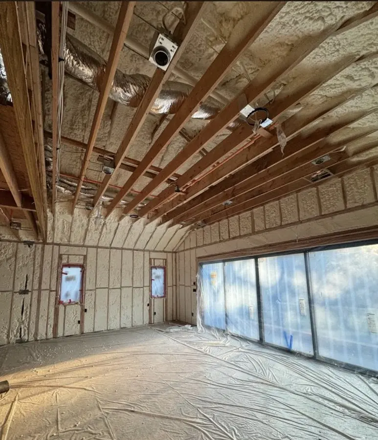 Interior walls and ceiling insulated with spray foam during new construction in Warwick